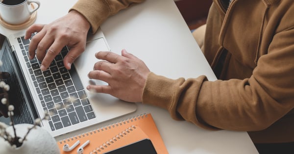 person using laptop at work