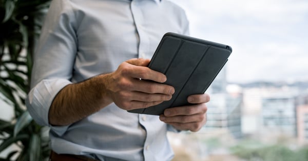 office worker holding tablet