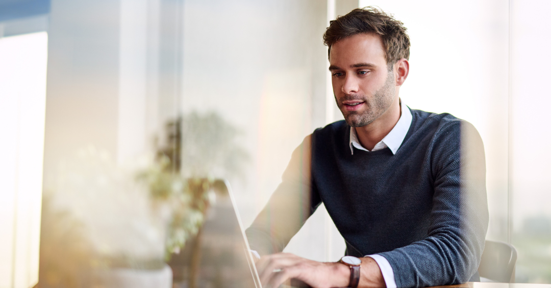 person typing on laptop