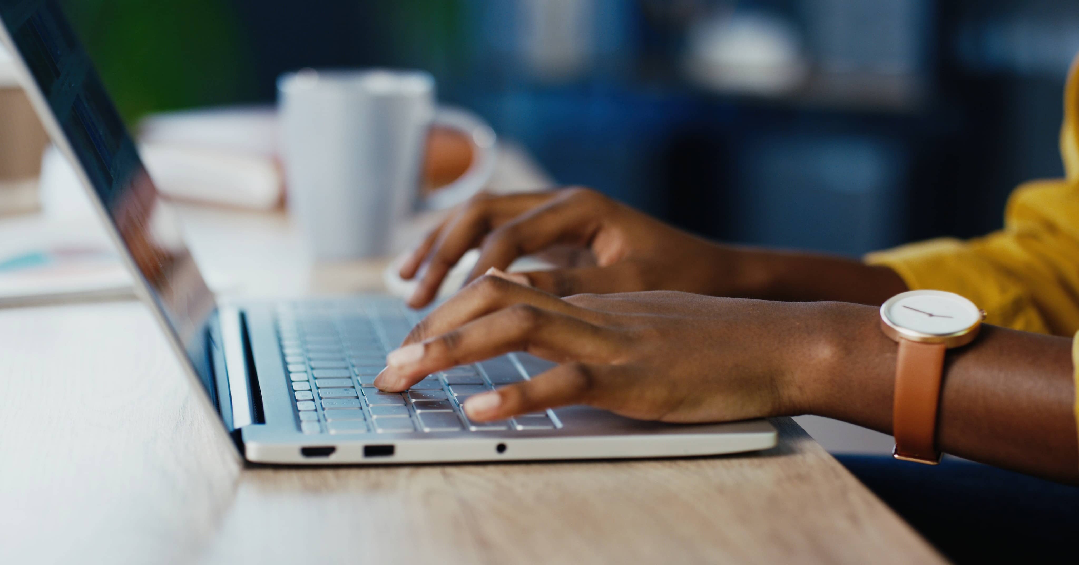 person typing on laptop